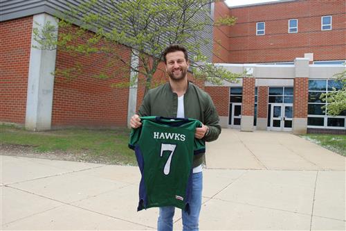 Barlett High graduate Chris Bukowski with his old football jersey 